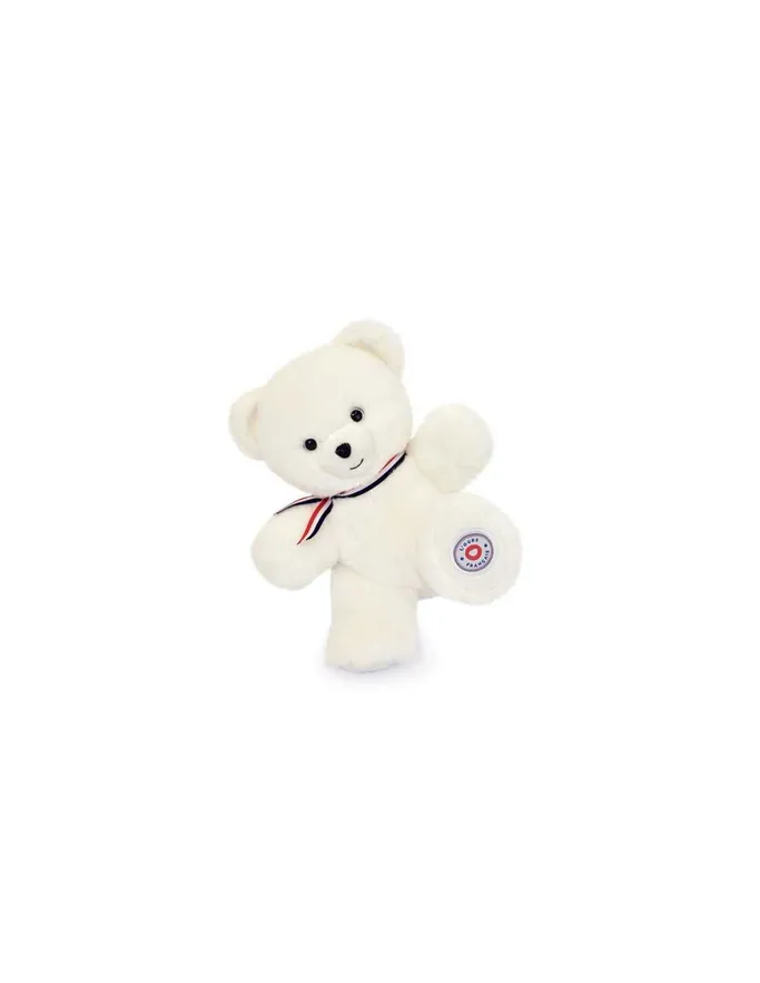 Un ours en peluche blanc au ruban bleu, blanc et rouge, sur fond blanc